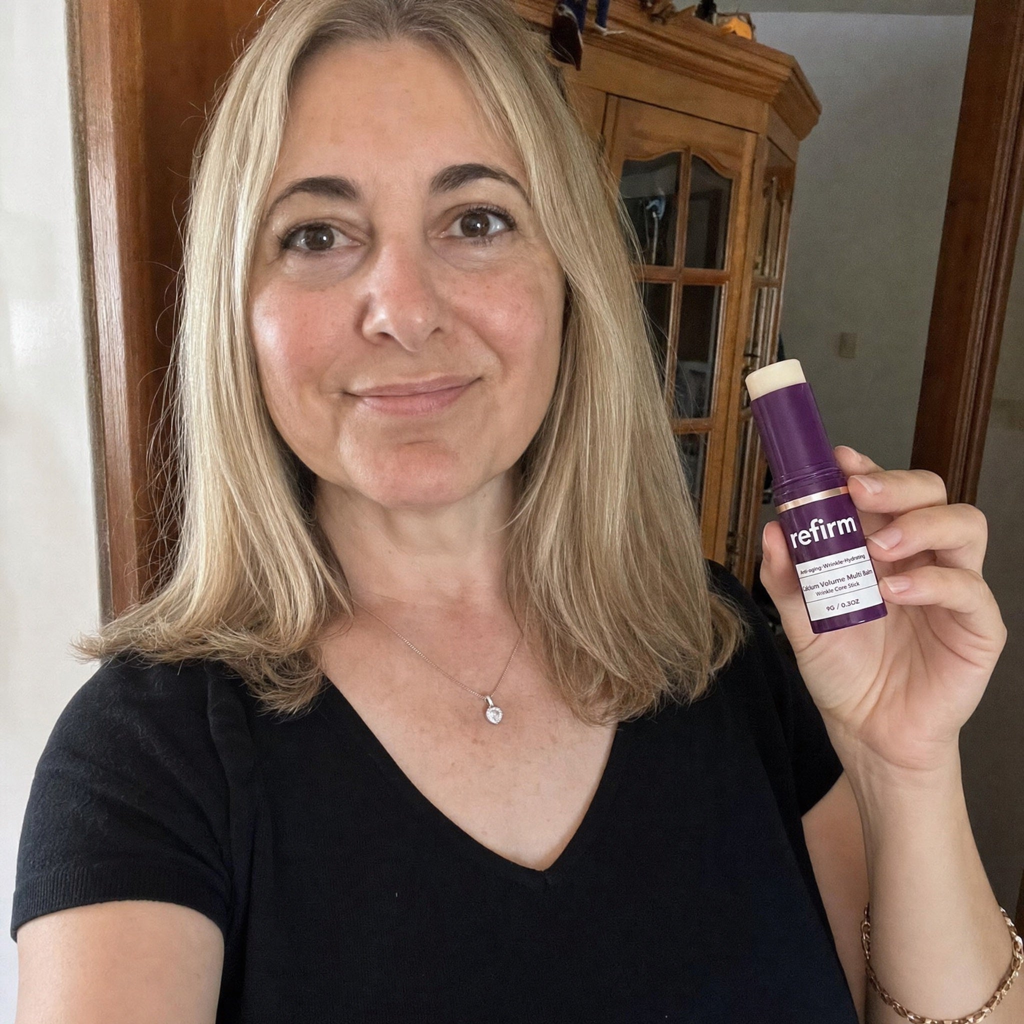 Hands twisting open Refirm Calcium Balm